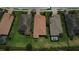 Aerial shot of a neighborhood highlighting well-manicured lawns, landscaping, and tile roofs at 11489 Bitola Dr, Odessa, FL 33556