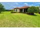 Expansive backyard with manicured lawn and view of the house at 11489 Bitola Dr, Odessa, FL 33556
