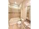 Bright bathroom with a tub shower combination and granite vanity at 11489 Bitola Dr, Odessa, FL 33556