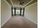 Unfurnished bedroom with tray ceilings, ceiling fan, and natural light at 11489 Bitola Dr, Odessa, FL 33556