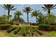Community entrance to Esplanade at Starkey Ranch with lush tropical landscaping at 11489 Bitola Dr, Odessa, FL 33556