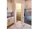 Walk-in pantry and stainless refrigerator enhance the kitchen's functionality at 11489 Bitola Dr, Odessa, FL 33556