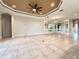 Expansive living room featuring stylish mirrors and a neutral color palette at 11489 Bitola Dr, Odessa, FL 33556