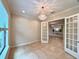 Open floor plan with French doors leading to an office space with a chandelier, with lots of natural light at 11489 Bitola Dr, Odessa, FL 33556