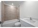 Bathroom featuring tiled shower-bathtub combination, a toilet, and a vanity sink at 116 Leisure Pl, Rotonda West, FL 33947