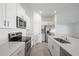 Beautiful kitchen with stainless steel appliances, modern cabinets, and stone countertops at 116 Leisure Pl, Rotonda West, FL 33947