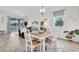 Open dining space with natural light; views of living area at 11626 Blue Woods Dr, Riverview, FL 33569