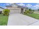Charming single-Gathering home with well-maintained landscaping and a spacious driveway at 11626 Blue Woods Dr, Riverview, FL 33569
