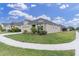 Charming one-story home with well-manicured lawn, lush landscaping, and inviting curb appeal at 11626 Blue Woods Dr, Riverview, FL 33569