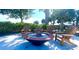 Outdoor firepit area with Adirondack chairs, perfect for relaxing at 11626 Blue Woods Dr, Riverview, FL 33569