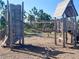 Community playground with a large wooden play structure and a variety of climbing and play features at 11626 Blue Woods Dr, Riverview, FL 33569
