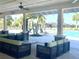 Comfortable poolside lounge area with ample seating and views of the community pool and palm trees at 11626 Blue Woods Dr, Riverview, FL 33569
