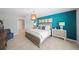 Bedroom with an accent wall, pendant light, and a large window at 118 Leisure Pl, Rotonda West, FL 33947