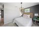 Bedroom with gray walls, a modern light fixture, and neutral decor at 118 Leisure Pl, Rotonda West, FL 33947