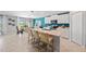 Bright kitchen with white cabinets, modern appliances, a center island, and dining area at 118 Leisure Pl, Rotonda West, FL 33947