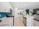 Bright kitchen with white cabinets, stainless steel appliances, and spacious countertops at 118 Leisure Pl, Rotonda West, FL 33947