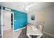 Bright home office featuring a patterned accent rug, a work desk, and decor at 118 Leisure Pl, Rotonda West, FL 33947
