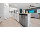 Open kitchen with stainless steel appliances and a view into the living area at 119 Leisure Pl, Rotonda West, FL 33947