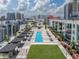 Aerial view of a condo rooftop pool and deck area featuring lounge seating and sunbathing spaces at 1208 E Kennedy Blvd # 914, Tampa, FL 33602