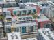 Overhead shot highlighting a rooftop pool deck and various amenities of a modern residential complex at 1208 E Kennedy Blvd # 914, Tampa, FL 33602
