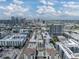 An aerial view of an urban area with a view of the Tampa skyline in the distance at 1208 E Kennedy Blvd # 914, Tampa, FL 33602