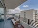 Charming balcony setting offering a cozy seating area and scenic urban outlook at 1208 E Kennedy Blvd # 914, Tampa, FL 33602
