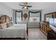 Bedroom with wood flooring and a large dresser and bed. Large window view can be seen from room at 1208 E Kennedy Blvd # 914, Tampa, FL 33602