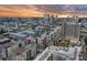 Cityscape aerial view showing multiple condo buildings, parks and skyscrapers during a sunset at 1208 E Kennedy Blvd # 914, Tampa, FL 33602