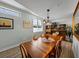 Comfortable dining room features a large table, wood floors, and a decorative display cabinet at 1208 E Kennedy Blvd # 914, Tampa, FL 33602