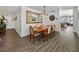 Dining room featuring a wood table with seating for six, modern light fixture, and hardwood floors at 1208 E Kennedy Blvd # 914, Tampa, FL 33602