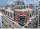 Multi-story condo building with glass balconies located in an urban setting with palm trees and street views at 1208 E Kennedy Blvd # 914, Tampa, FL 33602