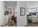 Hallway featuring a home office nook with wall art and access to the living room at 1208 E Kennedy Blvd # 914, Tampa, FL 33602