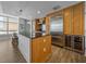 Kitchen with large island, stainless steel appliances, wooden cabinets, and ample counter space at 1208 E Kennedy Blvd # 914, Tampa, FL 33602