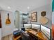 Home office with computer setup, a large window, and artistic wall decorations at 1208 E Kennedy Blvd # 914, Tampa, FL 33602