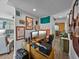 Home office with dual monitors, wall decorations and a connection to the kitchen at 1208 E Kennedy Blvd # 914, Tampa, FL 33602