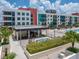 Beautiful condo complex featuring a gorgeous outdoor pool, lounging area, and bar under a sunny sky at 1208 E Kennedy Blvd # 914, Tampa, FL 33602