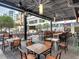 Stylish outdoor restaurant patio with modern tables, chairs, and a vibrant atmosphere perfect for dining at 1208 E Kennedy Blvd # 914, Tampa, FL 33602