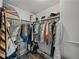 Well-organized walk-in closet with shelving, hanging racks, and waterproof engineered flooring at 1208 E Kennedy Blvd # 914, Tampa, FL 33602