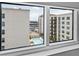 Attractive view from the window overlooking the community pool and surrounding buildings on a beautiful day at 1208 E Kennedy Blvd # 914, Tampa, FL 33602