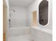 Modern bathroom with a soaking tub, sleek vanity, and stylish fixtures at 13 S Chamberlain Blvd, North Port, FL 34286