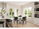 Cozy dining area with large windows and modern furniture at 13 S Chamberlain Blvd, North Port, FL 34286
