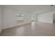 Spacious living room with access to the backyard through sliding glass doors at 1454 Atlas St, Port Charlotte, FL 33952