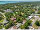 Aerial view of a residential neighborhood with lush greenery and distant views of the bay at 1500 Robinson N Dr, St Petersburg, FL 33710