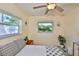 Bright bedroom features two windows, views to the outside, and side tables at 1500 Robinson N Dr, St Petersburg, FL 33710