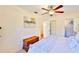 Bedroom featuring a wooden dresser, bright windows, a soft throw, and beach-themed decor at 1500 Robinson N Dr, St Petersburg, FL 33710