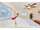 Bedroom with ample light, a large window, a soft throw, and decoratively styled side tables at 1500 Robinson N Dr, St Petersburg, FL 33710