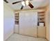A view of the Murphy bed closed to showcase the custom shelving and storage cabinets at 1500 Robinson N Dr, St Petersburg, FL 33710