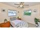 Bright bedroom with two windows and two side tables with storage at 1500 Robinson N Dr, St Petersburg, FL 33710