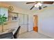 Office space features a built-in desk, shelving and storage with closet and door access at 1500 Robinson N Dr, St Petersburg, FL 33710