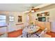 Eat-in dining area featuring ceiling fan, casual dining set with seating for four, and exterior access door at 1500 Robinson N Dr, St Petersburg, FL 33710